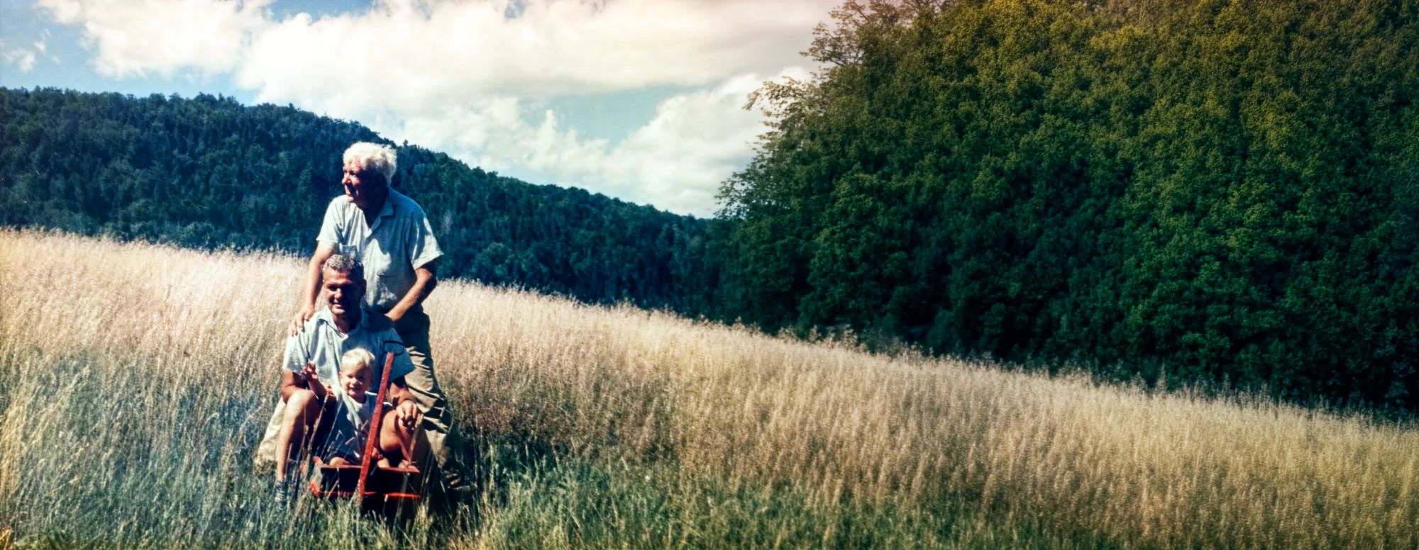 Bill Veghte, SAGE's CEO and co-founder, as a toddler in a hayfield with his father and grandfather